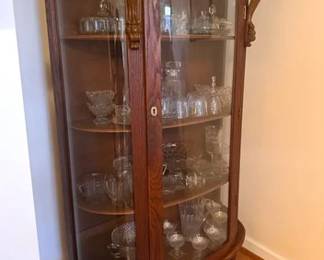 Oak bow front china cabinet and assorted glassware lots