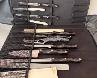 Assorted Cutco knives in a case