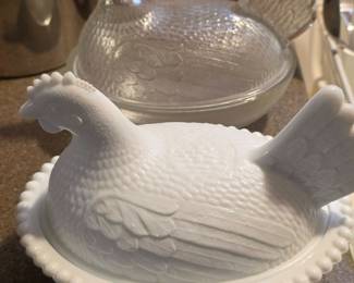 Milk glass and clear glass hens on nest