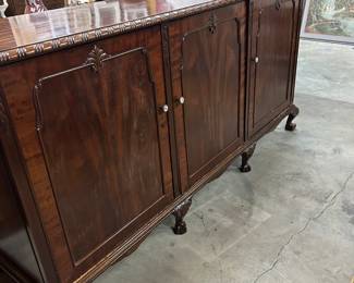 Long English Chippendale style carved mahogany three door cabinet on ball and claw feet, $675