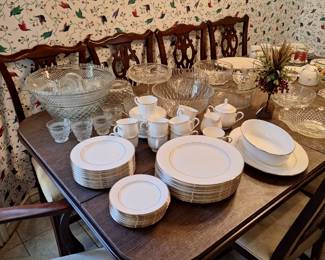 Lenox china and beautiful dining table with leaf and 8 chairs and table top cover