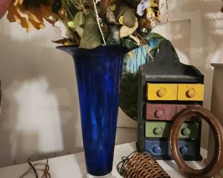 cobalt blue, hand-blown art glass vase with a clear base.