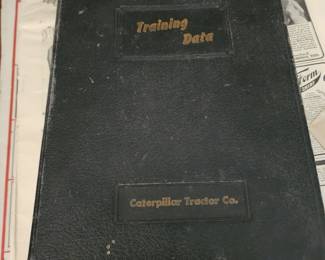 This is a vintage Caterpillar Tractor Company employee training manual or reference book. 