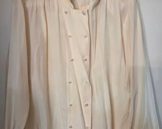 vintage cream-colored silk blend blouse with embroidered and beaded accents on the shoulders and collar. 