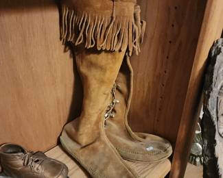 pair of Minnetonka Women's Front Lace Knee High Boots in brown suede. 
