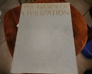 hardcover book titled The Dawn of Civilization, edited by Stuart Piggott. 