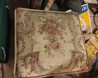 vintage tapestry foot stool with a floral design and brass legs. 