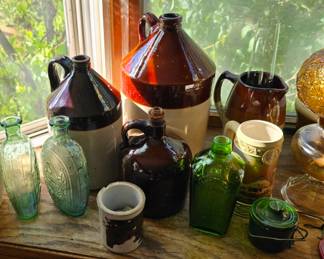 More stoneware and glass bottles.