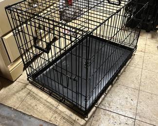 One of two black wire dog carriers. We have a cat taxi also! (not pictured)