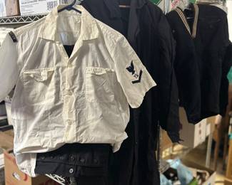 WW2 Navy tops and button-down front pants (under the white top) and the trench coat in the middle.