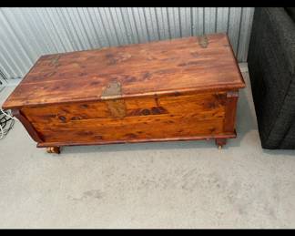 A cedar blanket chest with brass metal plates, 
