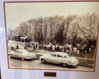 A framed photo celebrating an event of the SOO Line railroad in Waukesha. The 'Ten-Wheeler' in the photo was originally #247 and in 1909 was leased to the Soo Line and renumbered #2645. Built in 1900, it traveled 1 million miles hauling passengers and freight before being retired in 1952. Currently and hopefully will be stationed at The Mid-Continent Railway Museum in Freedom, WI.