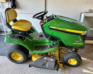 John Deere X350 riding lawn mower. In GREAT shape and just in time for the spring cutting.