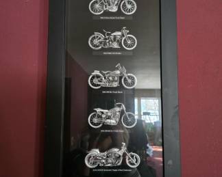 Examples of early Harley Davidson motorcycles. Framed.