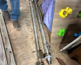 A pair of trailer axles. 