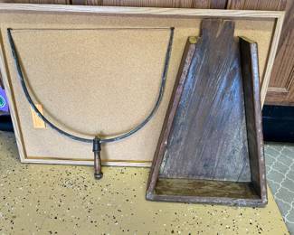 On the left is a wonderful antique country store cheese block cutter. 
On the right is a very interesting bread board where a roller was used to break up the bread to be poured into a bowl.