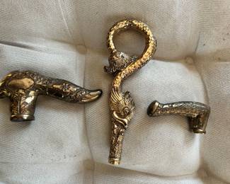 3 gold-plated cane handles.