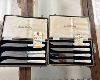 Two sets of Marshall Field and Company mother-of-pearl steak knives Sheffield, England, with original Luster case