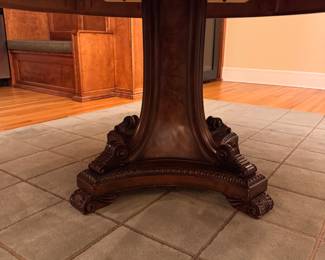 Burl Wood Pedestal Dining Table with Carved Base. Measures 60" D x 30" H with 26" Clearance. Photo 2 of 2.