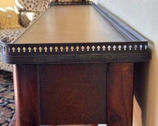 Theodore Alexander Louis XVI Leather Top Console and Brass Gallery. Measures 58" W x 11" D x 33" H to Gallery. Photo 3 of 7.