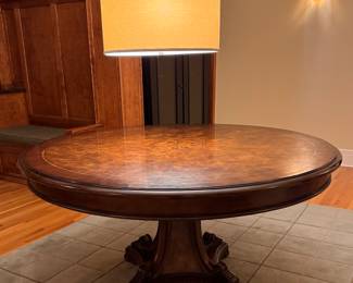 Burl Wood Pedestal Dining Table with Carved Base. Measures 60" D x 30" H with 26" Clearance. Photo 1 of 2.