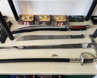 Bottom is a USMC sword