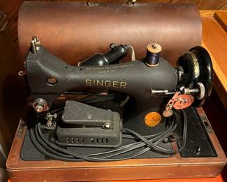 Antique Singer sewing machine with case.