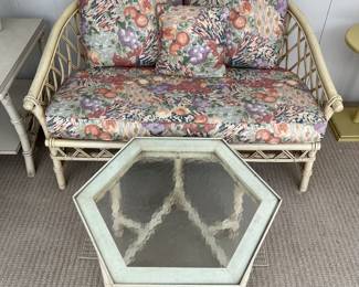Rattan loveseat and coffee table.