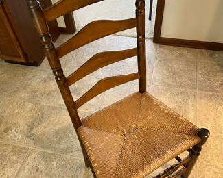 Closer look at one of the six ladder-back chairs to go with the Bent Rims table.