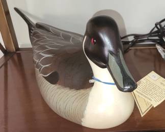 $100 (wooden decoy)