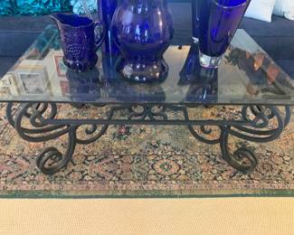 Wrought Iron and Beveled Glass Coffee Table on a Persian Area Rug