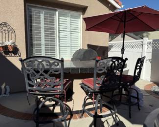 Outside decor, umbrella with stand.