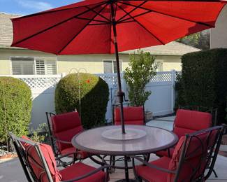 Clean and sturdy patio table w built in lazy susan. 6 deep seated chairs w/ cushions. NO RUST. 