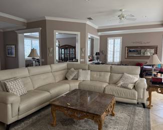 Large CLEAN and well kept leather sofa. Reclines on 3 different seats, adjustable heading. Decor pillows. 