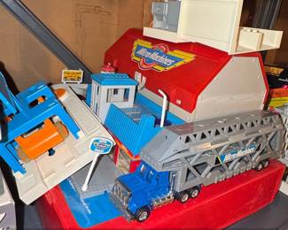 Micro Machines Super City Action Center Playset with Transporter Truck and Blue Truck