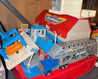 Micro Machines Super City Action Center Playset with Transporter Truck and Blue Truck