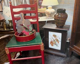 vintage red ladder back chair, antique wall cabinet with majolica inset in door