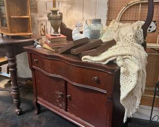 antique dry sink, lamps, framed art, blanket