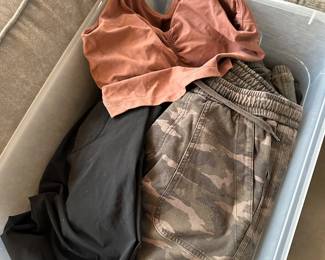 A bin of Lululemon and Athleta women's clothing!