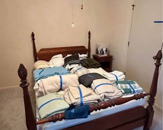 Queen size bed with Mahogany wood headboard and footboard.