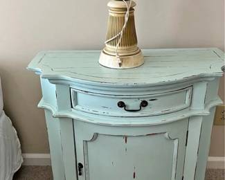 One of two matching night stands with matching lamps