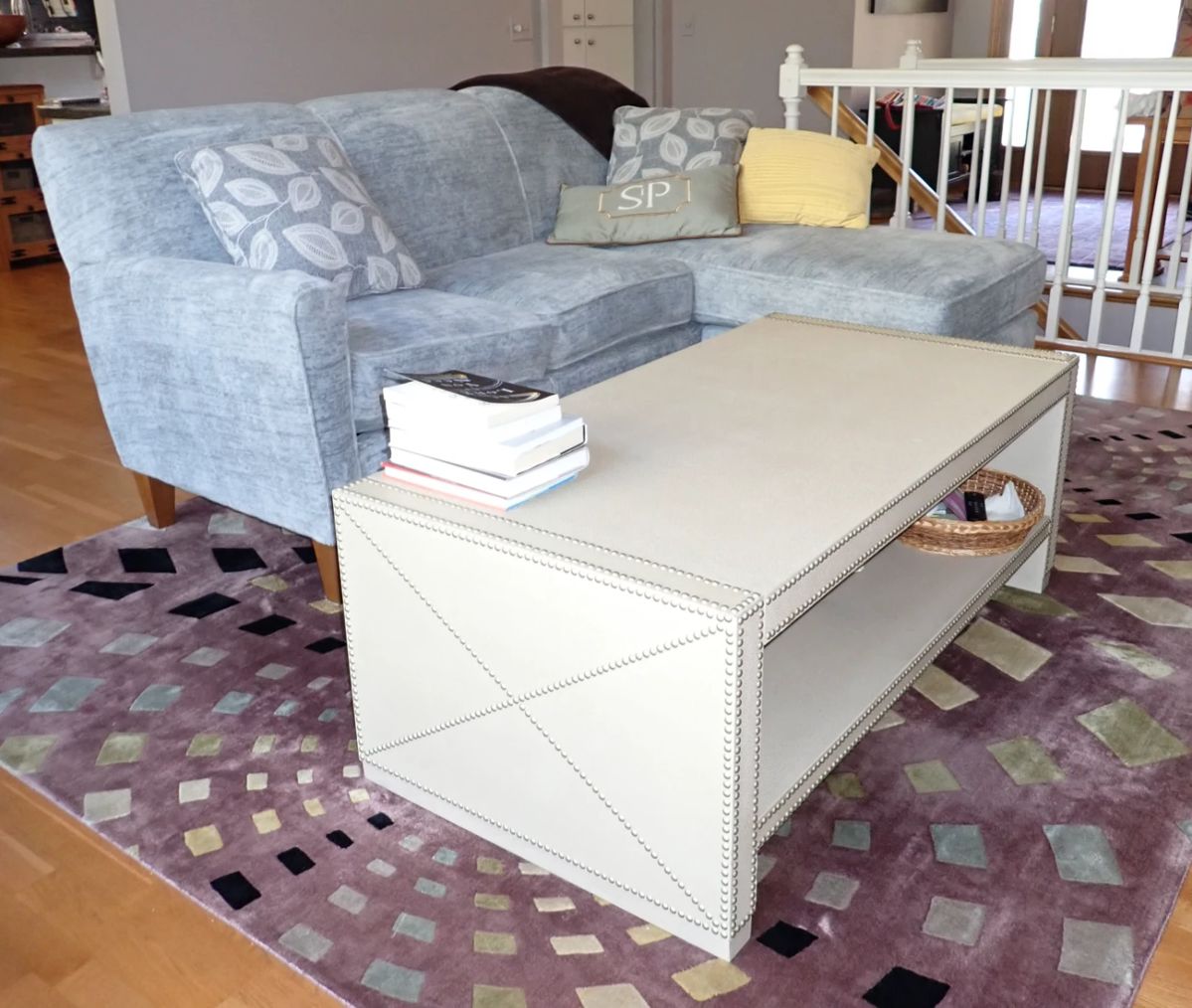 White storage coffee table / blue sofa/lounge - rug