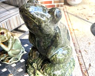 Playful ceramic garden frogs