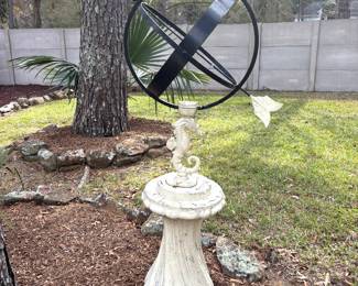 Iron armillary sundial mounted on pedestal