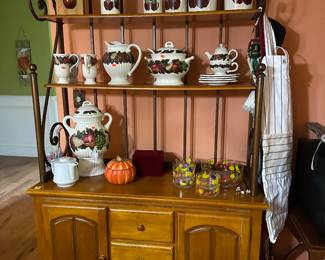 The bakers cabinet is sold. I am posting this picture to show the apple pottery.