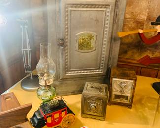 collection of early cast iron banks and notice the  1919 tin pie safe