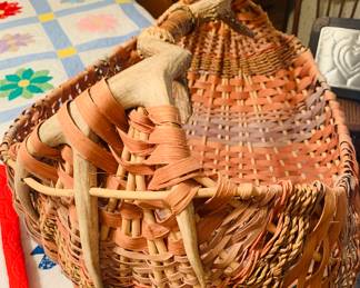 very large hand woven basket with antler and leather handle