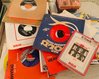1950s-1970s records  LPS and 45s--notice the unopened Elvis s8 track