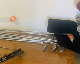 Two sets of golf clubs