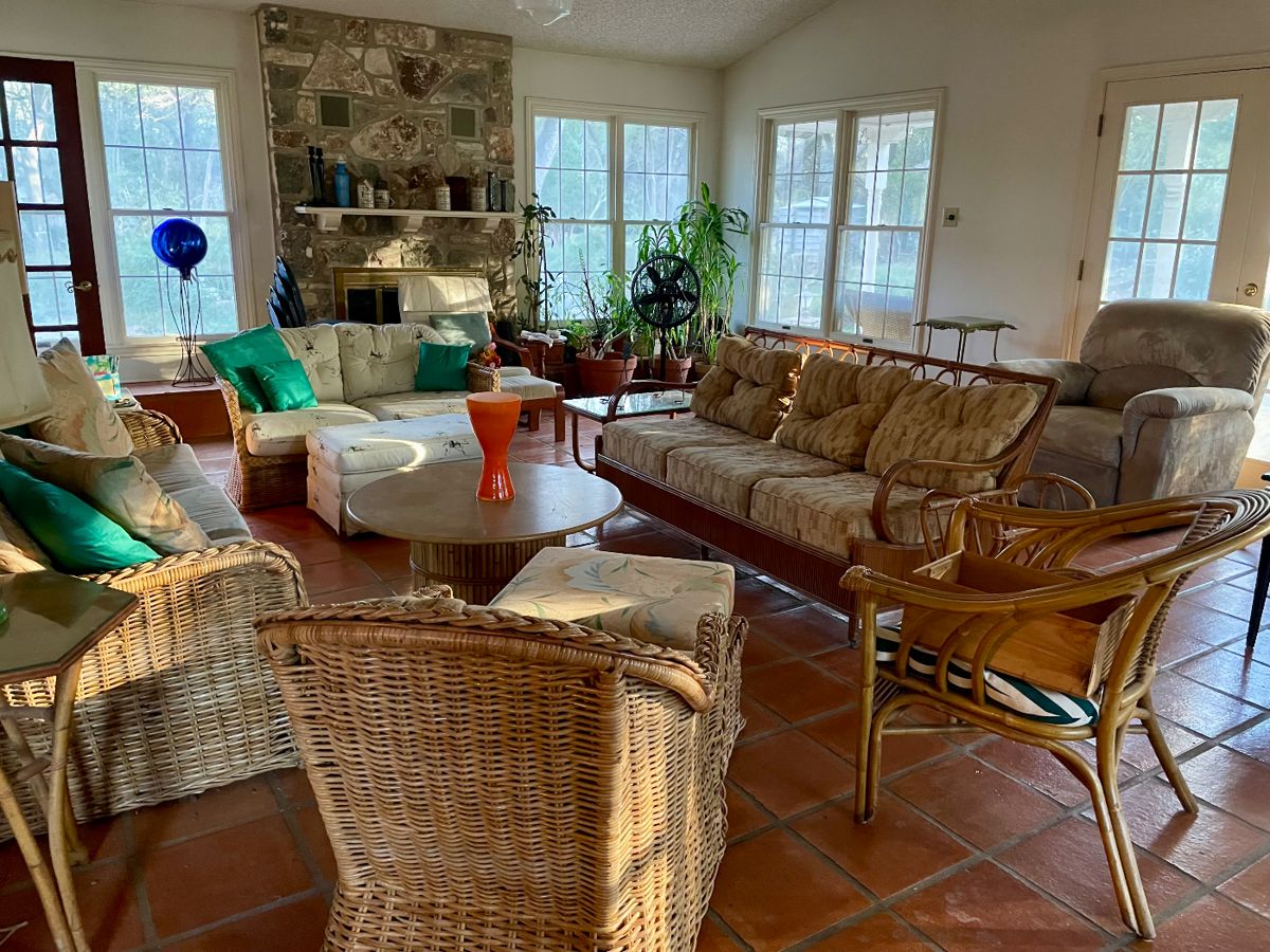 The Sun Room has the rattan. Note: houseplants are not for sale.